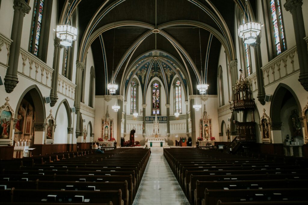 Moody, ornate Catholic church interior.
